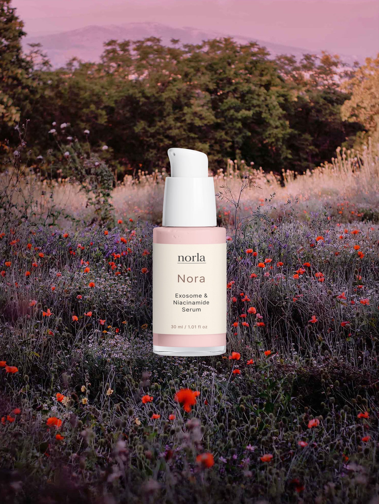 Nora — Exosome & Niacinamide Serum by Norla in a wildflower meadow at dusk