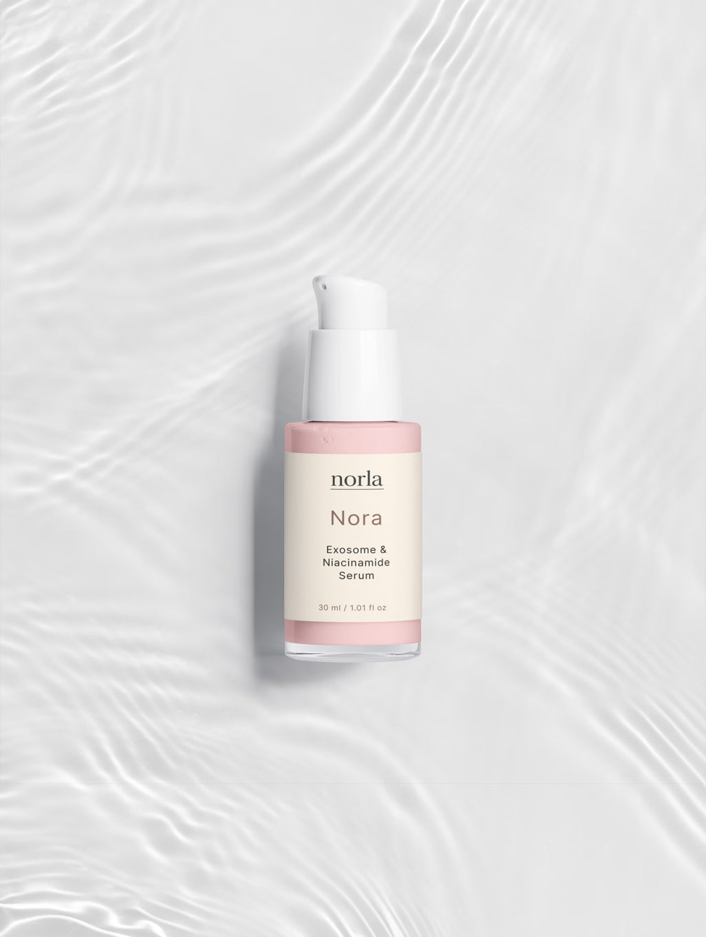 Nora — Exosome & Niacinamide Serum by Norla on rippled water