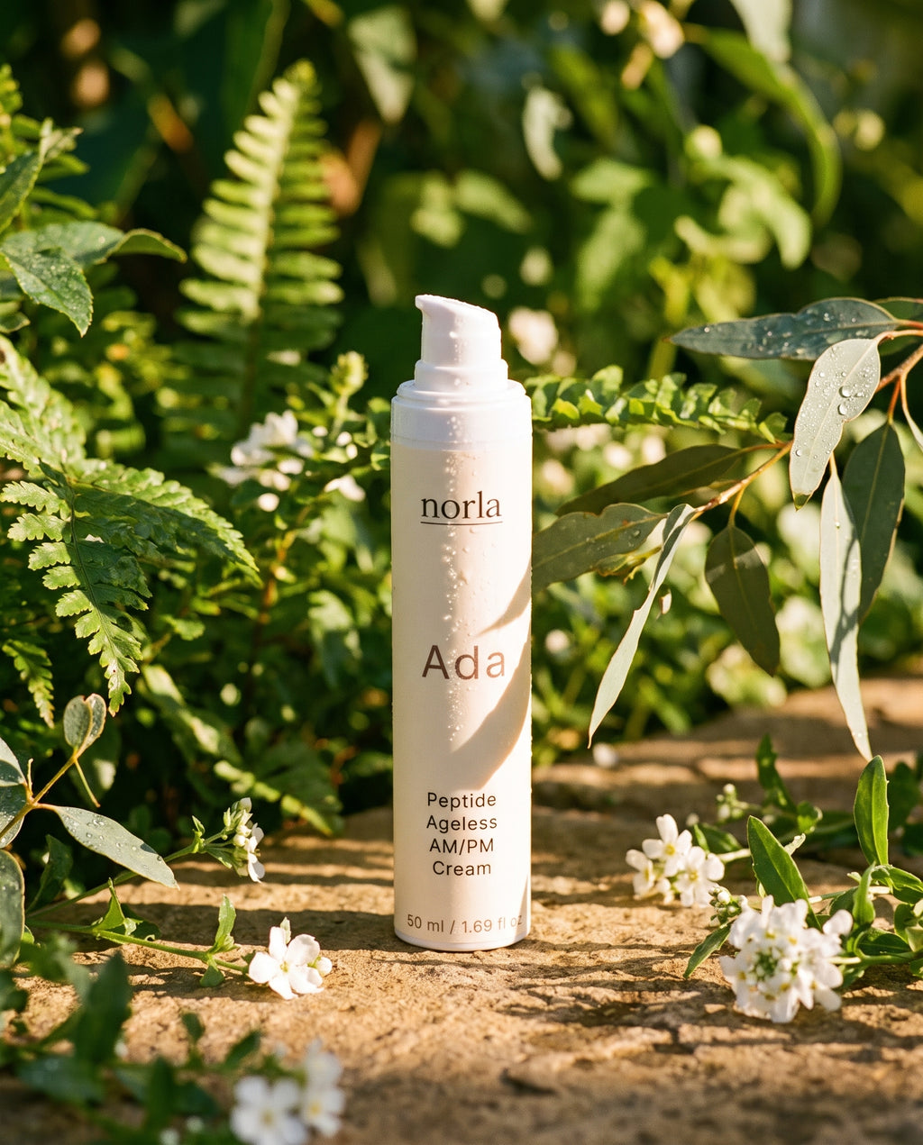 Norla Ada AM/PM cream photographed outdoors among greenery