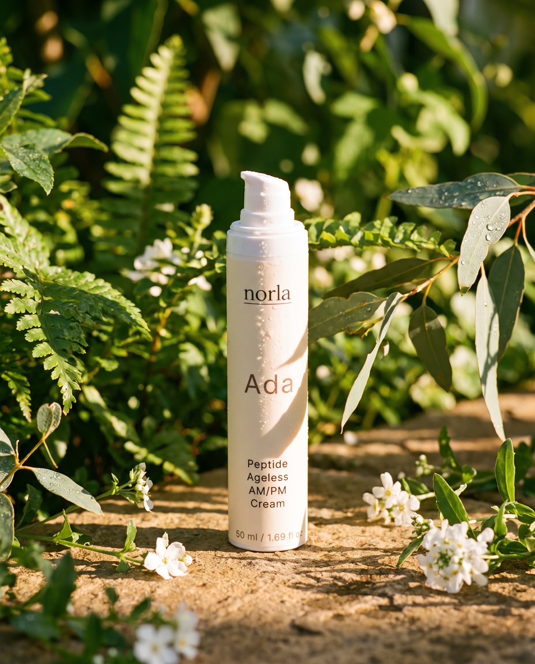 Norla Ada AM/PM cream photographed outdoors among greenery
