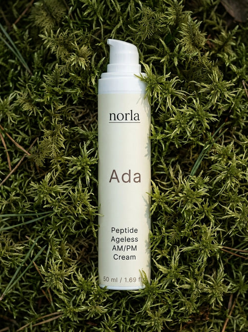 Ada Peptide Ageless AM/PM Cream 50 ml by Norla, cream airless pump bottle lying on green moss